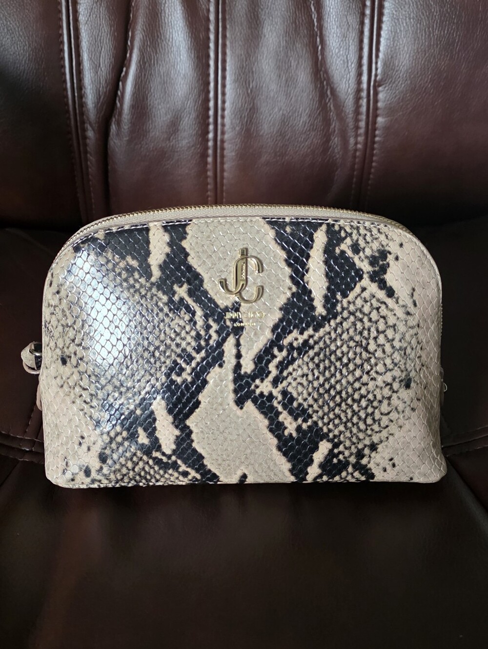 Jimmy Choo cosmetic pouch Python snakeskin and a gold-tone "JC" logo